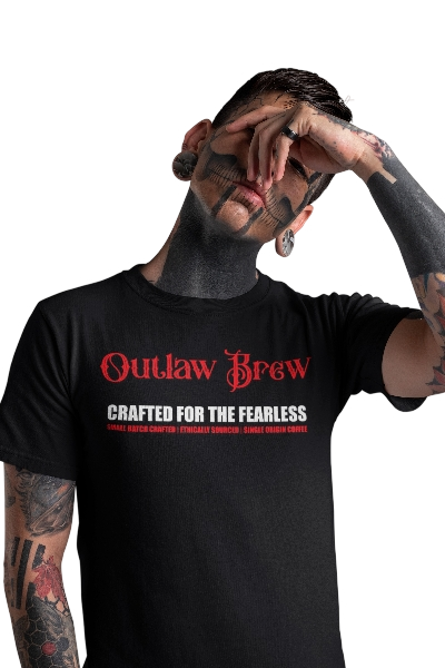 Desperado Drizzle official Outlaw Brew T-shirt, featuring the outlaw brew name in red and below the slogan Crafted for the fearless in white bold font. Below the slogan are the words small batch crafted, ethically sourced, single origin coffee in bold red font.